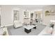 Bright living room with contemporary furniture, open to dining area and kitchen at 6800 E Lake Mead Blvd # 1018, Las Vegas, NV 89156