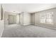 Spacious living room with neutral carpeting, sliding door, and natural light at 6800 E Lake Mead Blvd # 1018, Las Vegas, NV 89156