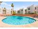 Sparkling community pool surrounded by well-maintained landscaping and lounging areas at 6800 E Lake Mead Blvd # 1018, Las Vegas, NV 89156