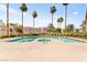 Community swimming pool with lounge chairs at 6800 E Lake Mead Blvd # 1018, Las Vegas, NV 89156