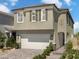 Charming two-story home showcasing a two-car garage, and inviting entrance at 7394 Daly Grove St, Las Vegas, NV 89113