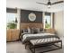 Serene main bedroom with wooden accents and stylish bench at the foot of the bed at 7394 Daly Grove St, Las Vegas, NV 89113