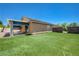 Large backyard with artificial turf and covered patio at 7488 Evening Falls Dr, Las Vegas, NV 89131