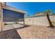 Backyard covered patio with brick hardscape and desert landscaping at 7488 Evening Falls Dr, Las Vegas, NV 89131