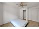 Carpeted bedroom featuring a ceiling fan and closet for storage at 7488 Evening Falls Dr, Las Vegas, NV 89131