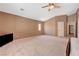 Large bedroom features neutral walls, vaulted ceiling, carpet flooring, and ceiling fan at 7488 Evening Falls Dr, Las Vegas, NV 89131