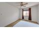 Neutral bedroom with a ceiling fan, window and carpeted flooring at 7488 Evening Falls Dr, Las Vegas, NV 89131