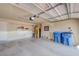 Spacious garage with shelving, door to house, and garage door to the outside at 7488 Evening Falls Dr, Las Vegas, NV 89131