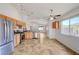 Spacious kitchen featuring stainless steel appliances, tile floors and light wood cabinetry at 7488 Evening Falls Dr, Las Vegas, NV 89131