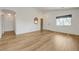 Spacious living room featuring wood flooring and large window at 7488 Evening Falls Dr, Las Vegas, NV 89131