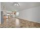 Open concept living room connects seamlessly to kitchen area with natural light and neutral decor at 7488 Evening Falls Dr, Las Vegas, NV 89131
