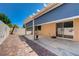Cozy covered patio featuring brick pavers and sun shades at 7488 Evening Falls Dr, Las Vegas, NV 89131