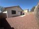 Expansive backyard with gravel landscaping and patio area, offering a private and versatile outdoor space at 8042 Palace Monaco Ave, Las Vegas, NV 89117