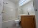 Bathroom featuring a shower-tub combo and vanity with a wood cabinet at 8042 Palace Monaco Ave, Las Vegas, NV 89117