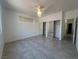 Spacious bedroom with tile flooring, ceiling fan, and a closet with mirrored doors at 8042 Palace Monaco Ave, Las Vegas, NV 89117