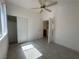 Bright bedroom featuring ample natural light, ceiling fan, and closet space at 8042 Palace Monaco Ave, Las Vegas, NV 89117