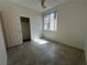 This bedroom features a ceiling fan, natural light, and tile flooring at 8042 Palace Monaco Ave, Las Vegas, NV 89117