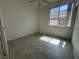 Sunlit bedroom featuring neutral tones, tiled flooring, and a bright window at 8042 Palace Monaco Ave, Las Vegas, NV 89117