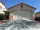 Charming single-story home featuring a two-car garage and desert landscaping at 8042 Palace Monaco Ave, Las Vegas, NV 89117