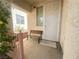 Comfortable front porch features a bench and offers a cozy and shaded entrance at 8042 Palace Monaco Ave, Las Vegas, NV 89117