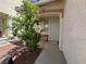 Inviting front porch with a bench, offering a cozy and shaded entrance at 8042 Palace Monaco Ave, Las Vegas, NV 89117