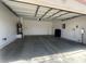 Spacious two-car garage featuring an automatic door and ample room for parking and storage at 8042 Palace Monaco Ave, Las Vegas, NV 89117
