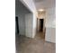 Hallway with multiple doors leading to other rooms, creating a sense of flow and privacy at 8042 Palace Monaco Ave, Las Vegas, NV 89117