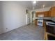 Bright kitchen with tile floors, ample counter space, and white appliances, ready for culinary adventures at 8042 Palace Monaco Ave, Las Vegas, NV 89117