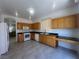 Spacious kitchen featuring wood cabinets and stainless steel appliances at 8042 Palace Monaco Ave, Las Vegas, NV 89117