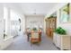 Bright dining room with large windows, a chandelier, and a wooden dining table set for a meal at 8244 Horseshoe Bend Ln, Las Vegas, NV 89113