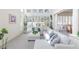 Spacious living room with high ceilings, lots of natural light, and comfortable seating area with an ottoman at 8244 Horseshoe Bend Ln, Las Vegas, NV 89113