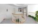 Bright foyer and staircase with curved railing and white accents throughout the home at 8244 Horseshoe Bend Ln, Las Vegas, NV 89113