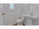 Half bathroom featuring a toilet and pedestal sink at 9100 Hombard Ave, Las Vegas, NV 89148
