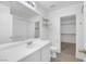 Bright bathroom featuring a clean white vanity and well-lit mirror at 9100 Hombard Ave, Las Vegas, NV 89148