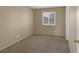 Bedroom featuring a window for natural light and neutral color palette at 9100 Hombard Ave, Las Vegas, NV 89148