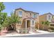 Charming home featuring a covered entryway and neat landscaping, creating a welcoming curb appeal for potential homeowners at 9100 Hombard Ave, Las Vegas, NV 89148