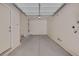 Spacious and empty two car garage with overhead lighting at 9100 Hombard Ave, Las Vegas, NV 89148