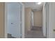 Carpeted hallway with doors leading to different rooms at 9100 Hombard Ave, Las Vegas, NV 89148