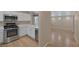Well-equipped kitchen featuring stainless steel appliances, ample counter space, and seamless transition to a living area at 9100 Hombard Ave, Las Vegas, NV 89148