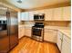 Modern kitchen with stainless steel appliances, white cabinets, and light countertops at 9100 Hombard Ave, Las Vegas, NV 89148