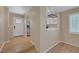 Inviting foyer leading to a stylish kitchen, featuring white cabinets and natural light, perfect for cooking and entertaining at 9100 Hombard Ave, Las Vegas, NV 89148