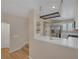 Bright kitchen featuring stainless steel appliances, white cabinets, and a hanging pot rack at 9100 Hombard Ave, Las Vegas, NV 89148