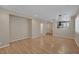 Spacious living area featuring laminate wood flooring and open floor plan at 9100 Hombard Ave, Las Vegas, NV 89148