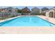 Community pool with lounge chairs at 9100 Hombard Ave, Las Vegas, NV 89148