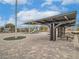 Community playground with shade and picnic tables on a brick-paved common area at 1034 Fish Pond Ave, Henderson, NV 89014