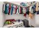 Well-organized walk-in closet with toys, clothes, and storage at 1034 Fish Pond Ave, Henderson, NV 89014