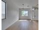 Spacious living room with hardwood flooring and natural light from multiple windows at 10452 Niagara Falls Ln, Las Vegas, NV 89144