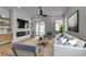 Comfortable living room with neutral tones, modern furniture, a fireplace and large windows for natural light at 10452 Niagara Falls Ln, Las Vegas, NV 89144