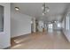 Open floor plan with wood floors, leading from the entryway to the kitchen and backyard at 10452 Niagara Falls Ln, Las Vegas, NV 89144