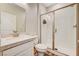 Modern bathroom featuring a glass enclosed shower with white subway tile and a vanity at 10650 Dryades Ave, Las Vegas, NV 89166